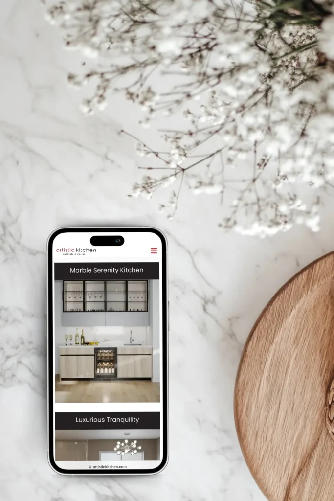 A sleek and modern mobile-friendly website layout for Artistic Kitchen, showcasing a high-end kitchen project with a marble countertop and contemporary cabinetry