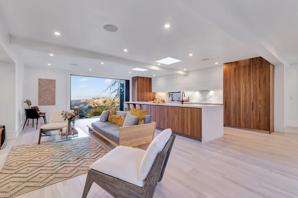 Modern kitchen featuring sleek cabinetry, a spacious island with seating, and elegant pendant lighting for a sophisticated look