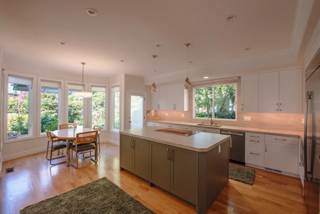 Open-concept kitchen with warm wood cabinetry, modern fixtures, and a thoughtfully designed layout for both cooking and entertaining
