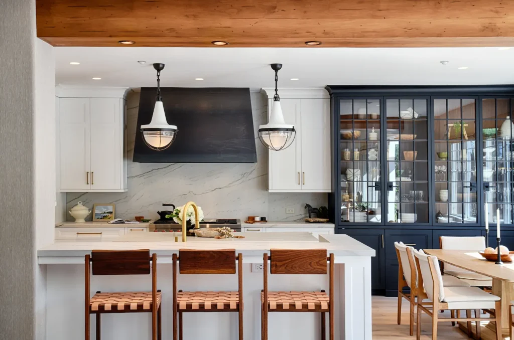 High-end kitchen featuring custom cabinets, ample natural light, and a refined layout that combines elegance with everyday functionality